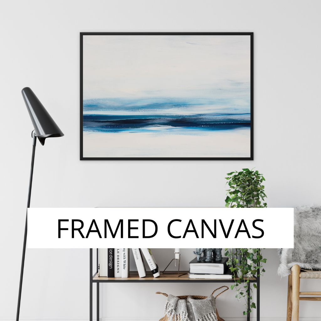 framed cavas art print of sea and beach painting on a wall in a living room