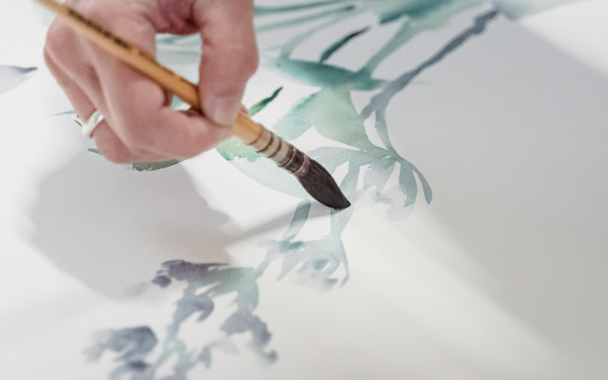 artist painting botanical art in studio - beach house art watercolour seaweed print
