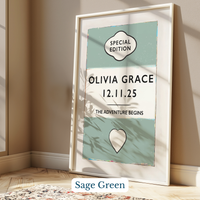 Personalised baby name print - Framed artwork with 'Olivia Grace' and date on a light green background, leaning against a wall.