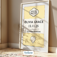 Personalised baby name print - Framed artwork with 'Olivia Grace' and '12.11.25' on a yellow background, placed on a wooden floor.
