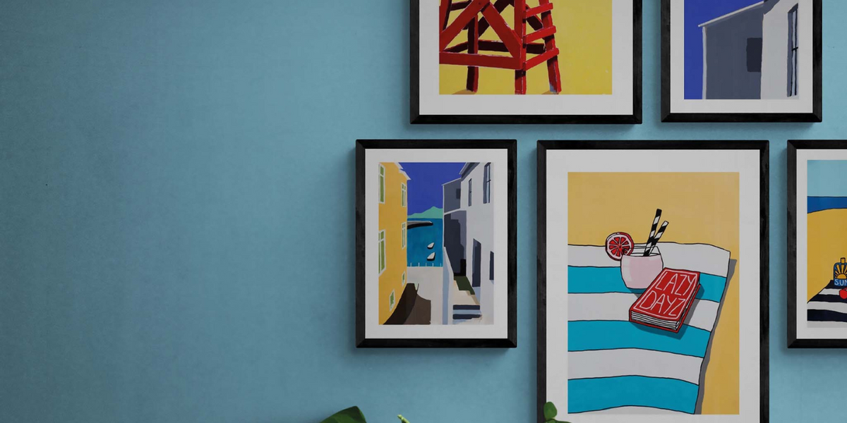 set of colourful art print in a gallery wall - colourful coastal art prints
