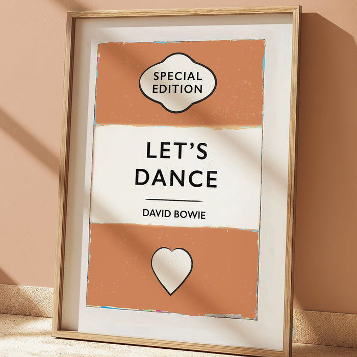 Framed poster with 'Special Edition Let's Dance' text on a beige wall.