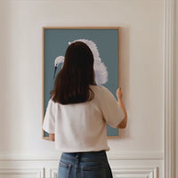 set of three bird art prints framed on wall with natural wooden picture frames