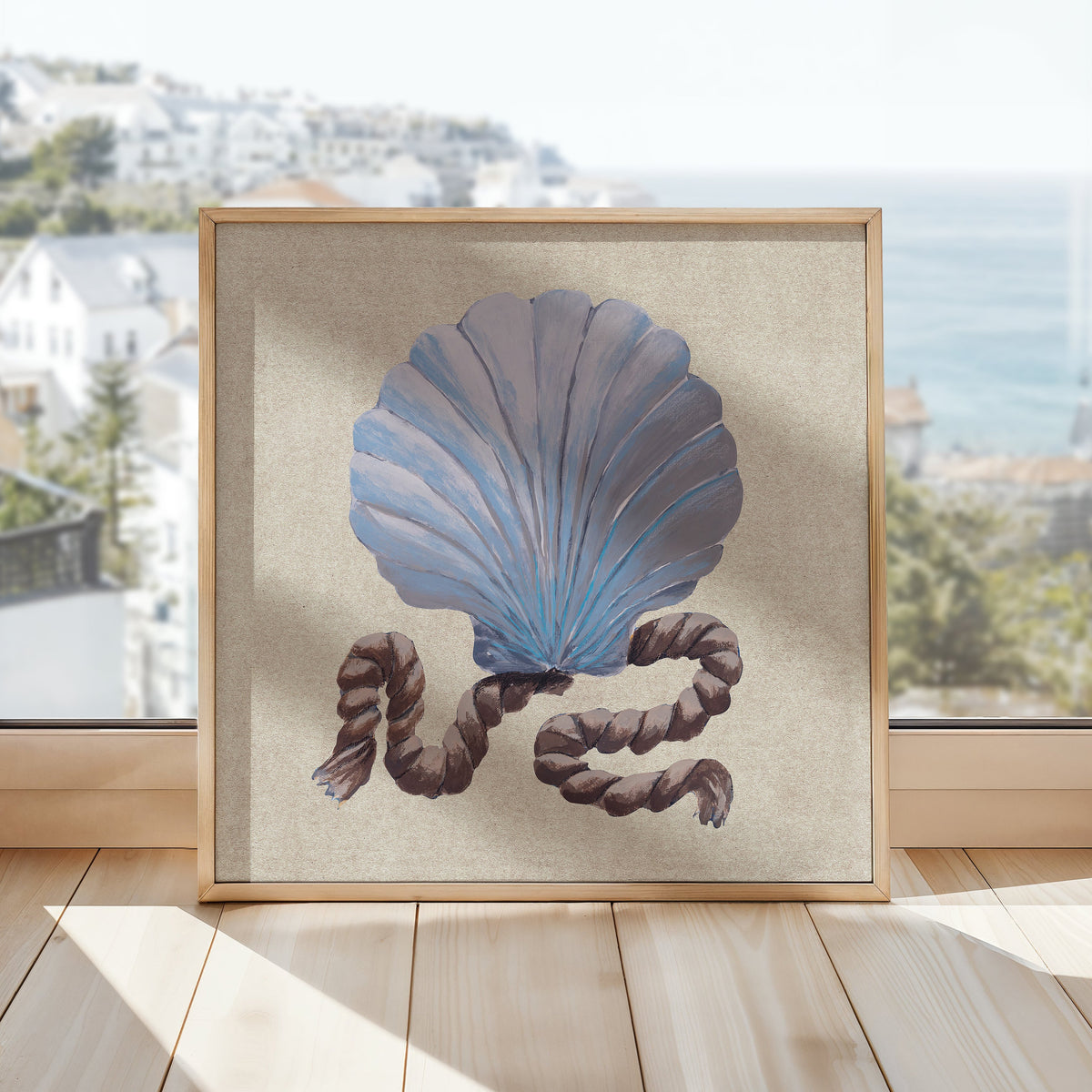 Framed artwork of a blue shell with brown accents on a light wooden floor.