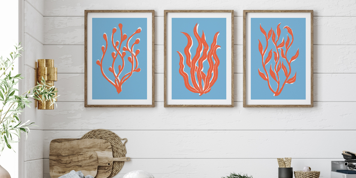 set of three blue art prints on wall in a kitchen - blue art prints framed
