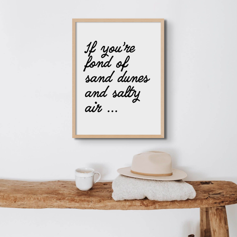 black and white typography wall art print in hallway in beach house