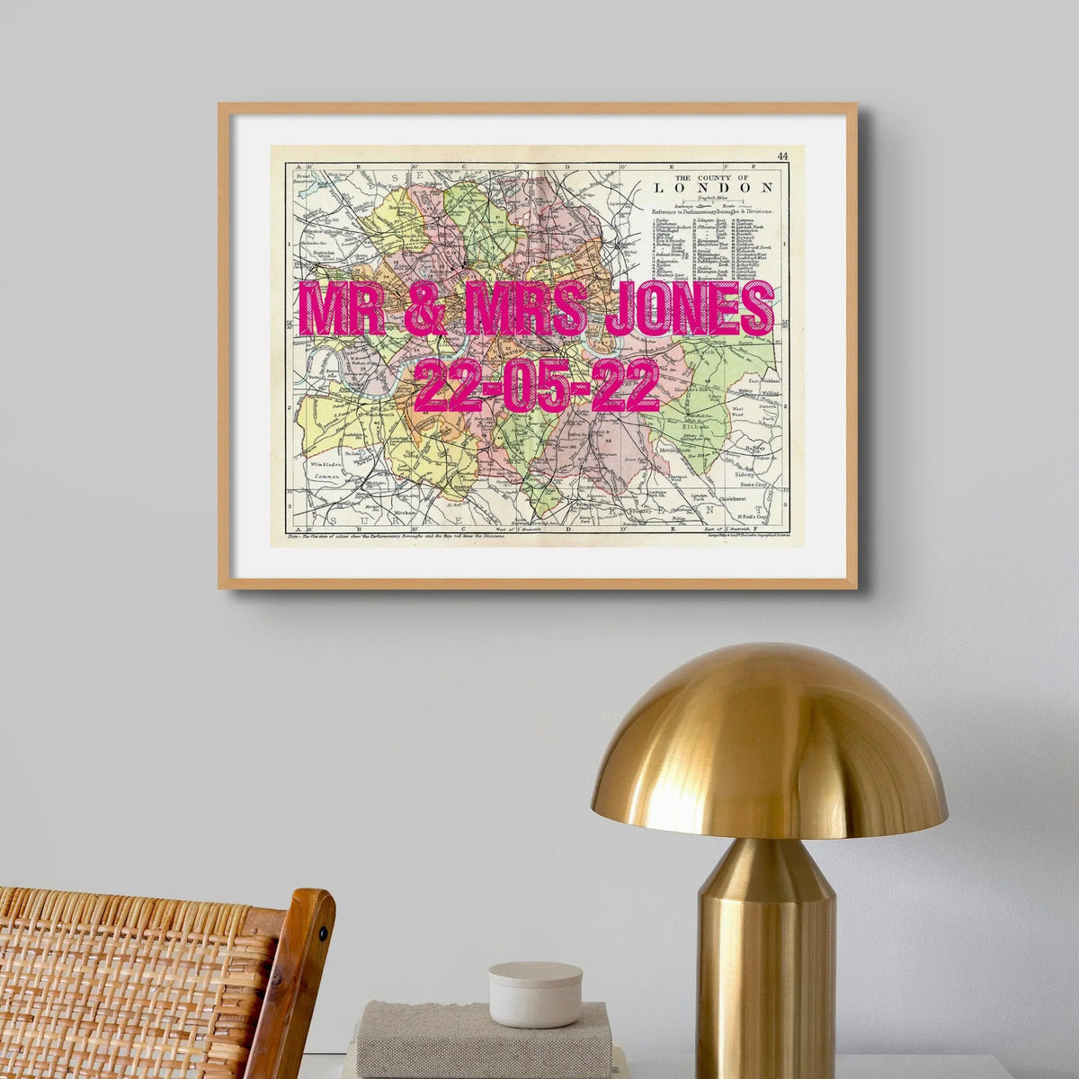 Coastal wall art featuring a personalised vintage city map print of London with pink font  - Unframed wall art