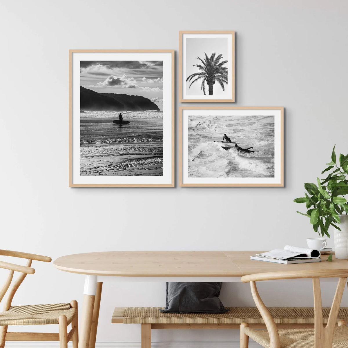 set of three black & white beach art photographs in natural frames in a scandi dining room - beach house art