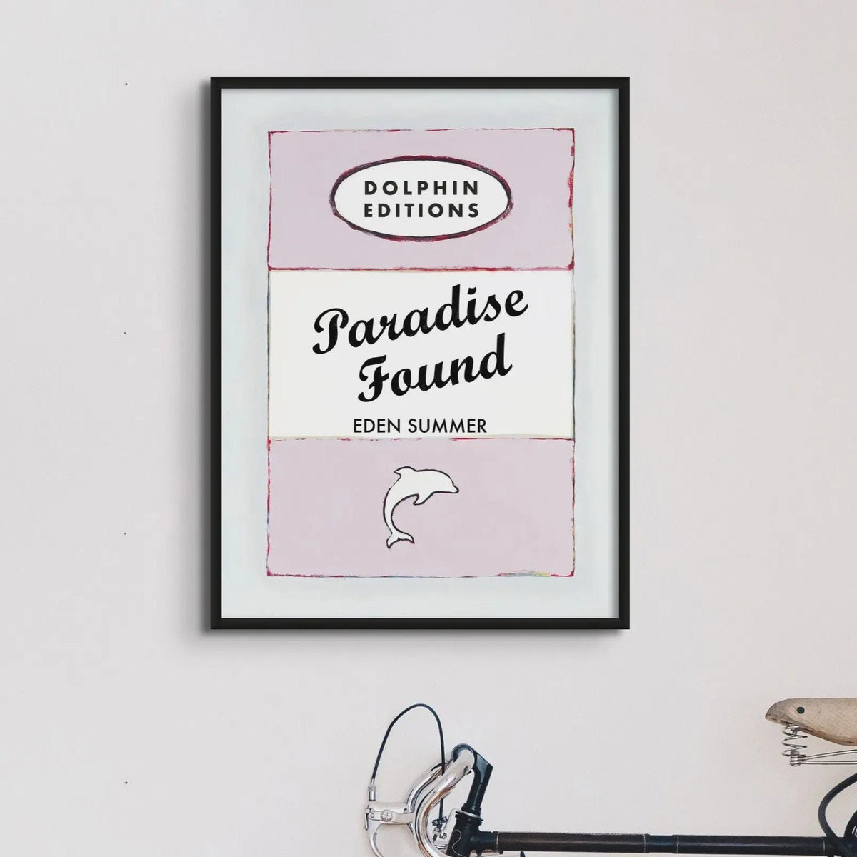 this framed print features a vintage book cover art poster of "Paradise Found" in pink.