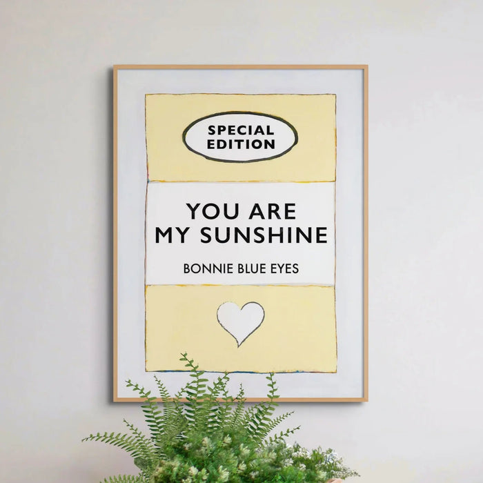 Beach House Art | You Are My Sunshine | Lyric Book Cover Art Print in white frame above pot plant
