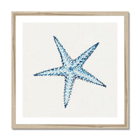 Framed artwork of a blue starfish on a white background