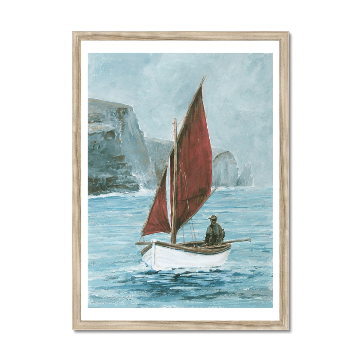 Framed artwork of a sailboat with a red sail on a blue sea with cliffs in the background.