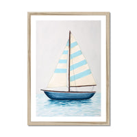 Framed artwork of a sailboat with striped sails on a light gray background