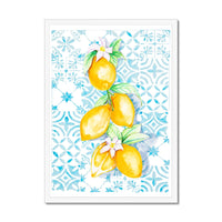 Framed artwork of lemons and flowers on a blue patterned background