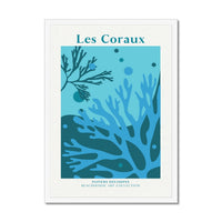 Framed coral artwork of underwater scene with coral and seaweed, featuring 'Les Coraux' text.