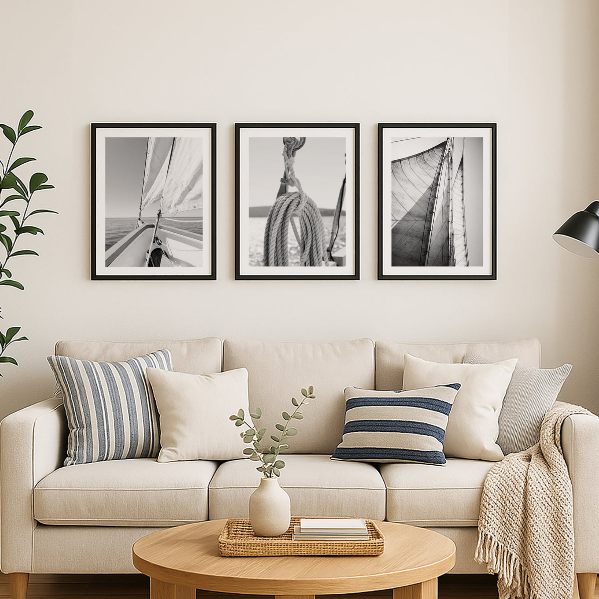 Living room with beige sofa, wooden coffee table, and framed black and white pictures on the wall.