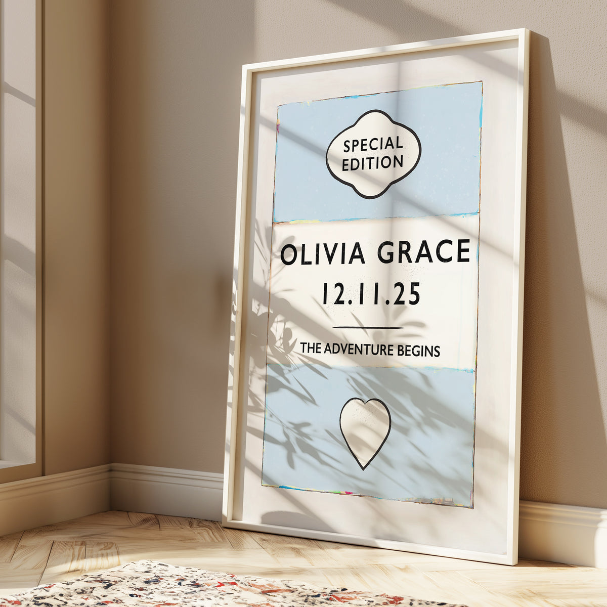 Framed personalised baby name print Framed artwork with 'Olivia Grace' and date on a wall.