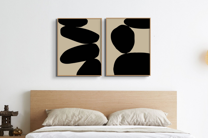 set of 2 Scandinavian bedroom art prints with wooden headboard. black and beige balancing stone art prints for bedroom