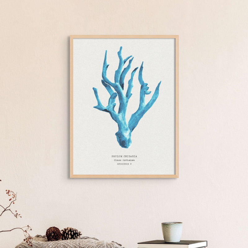Set of three coral art prints - coral paintings as a set framed in natural frame above a bed. 