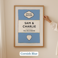 Personalised wedding/engagement print. Framed artwork with 'Sam & Charlie' text and 'Cornish Blue' color on a beige wall.