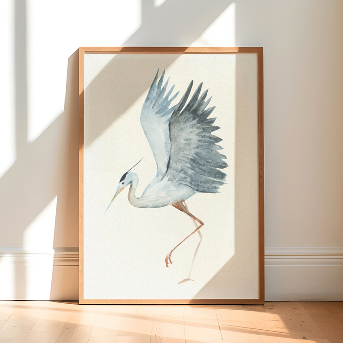 Heron Art Print - Framed artwork of a heron on a white background, leaning against a wall with sunlight casting shadows.