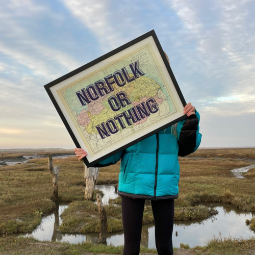 Norfolk Map print being held in the fens.