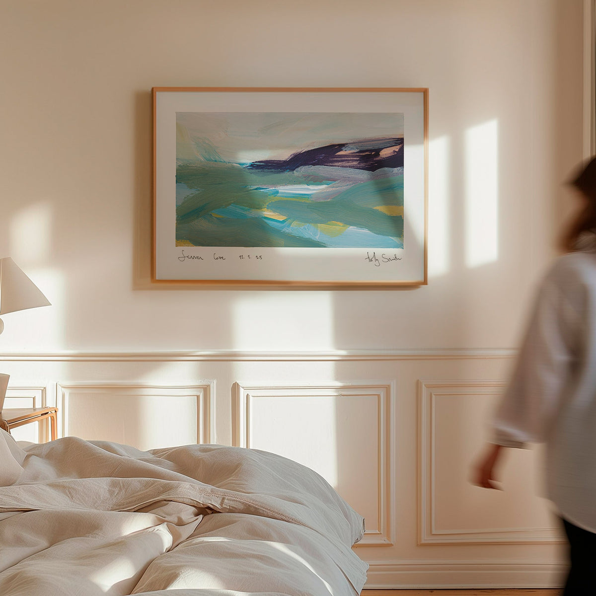 A framed abstract landscape painting of Sennen Cove in Cornwall, featuring teal, green, blue, and dark purple brushstrokes on a white mat with a black frame.