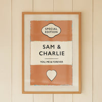 Personalised wedding/engagement print. Framed artwork with 'Special Edition' and 'Sam & Charlie' text in a room with a window and wicker chair.