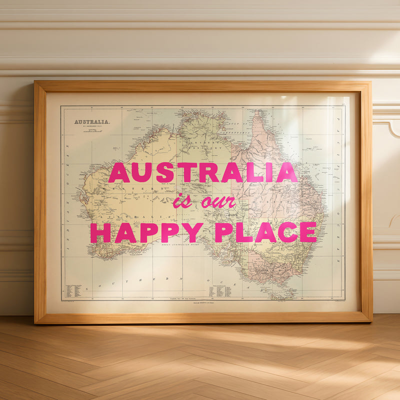 Framed map of Australia with 'Australia is our Happy Place' text on a wooden floor.