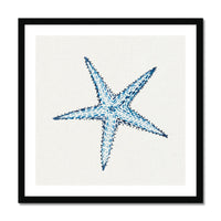 Framed artwork of a blue starfish on a white background