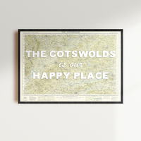 Framed map with 'The Cotswolds is our happy place' text on a white wall