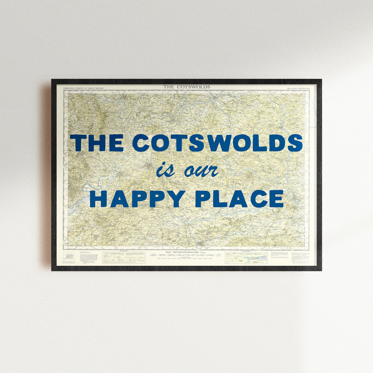 Framed cotswolds map art print with 'The Cotswolds is our happy place' text on a light gray background