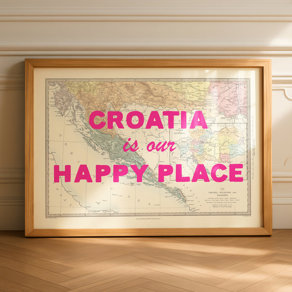 Framed map of Croatia with 'Croatia is our happy place' text on a wooden floor.