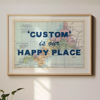 Framed map with 'Custom is our Happy Place' text on a wall.