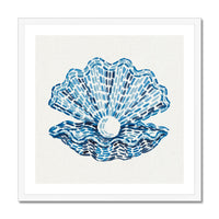 Framed artwork of a blue shell with a white pearl on a beige background