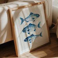 Frame fish art print in living room by sofa 