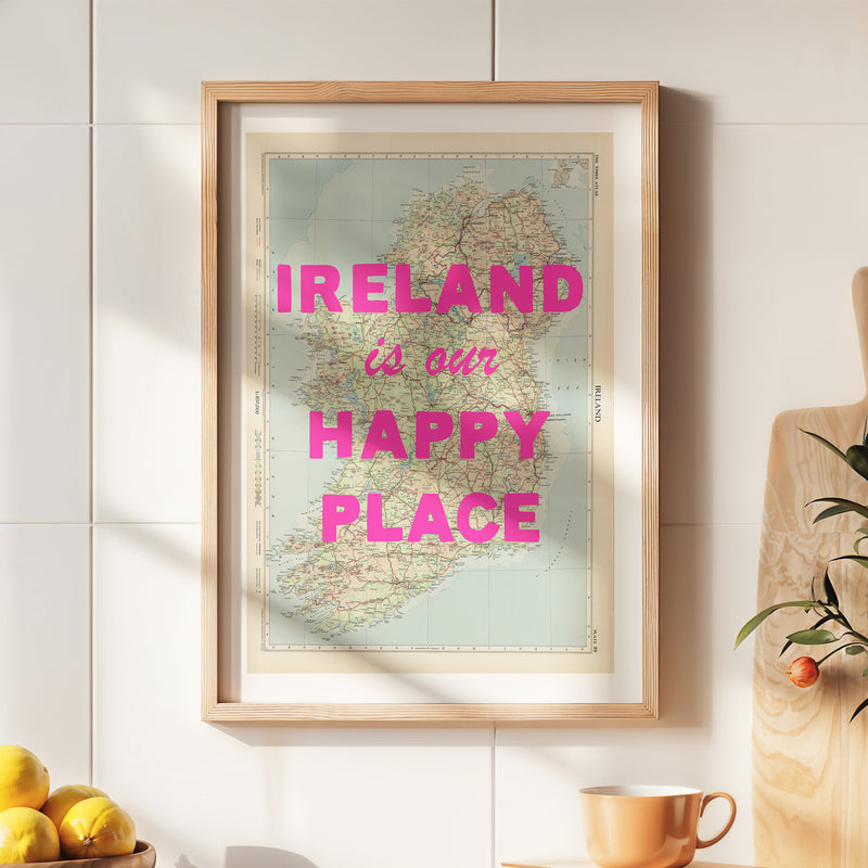 Framed map of Ireland with 'IRELAND is our HAPPY PLACE' text on a wall.