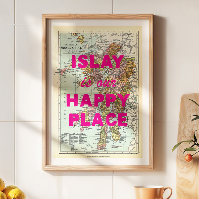 Framed map of Islay with 'Islay is our happy place' text on a wall.