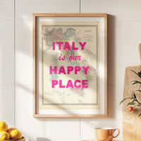 Framed map with 'Italy is our happy place' text on a wall with decor elements.