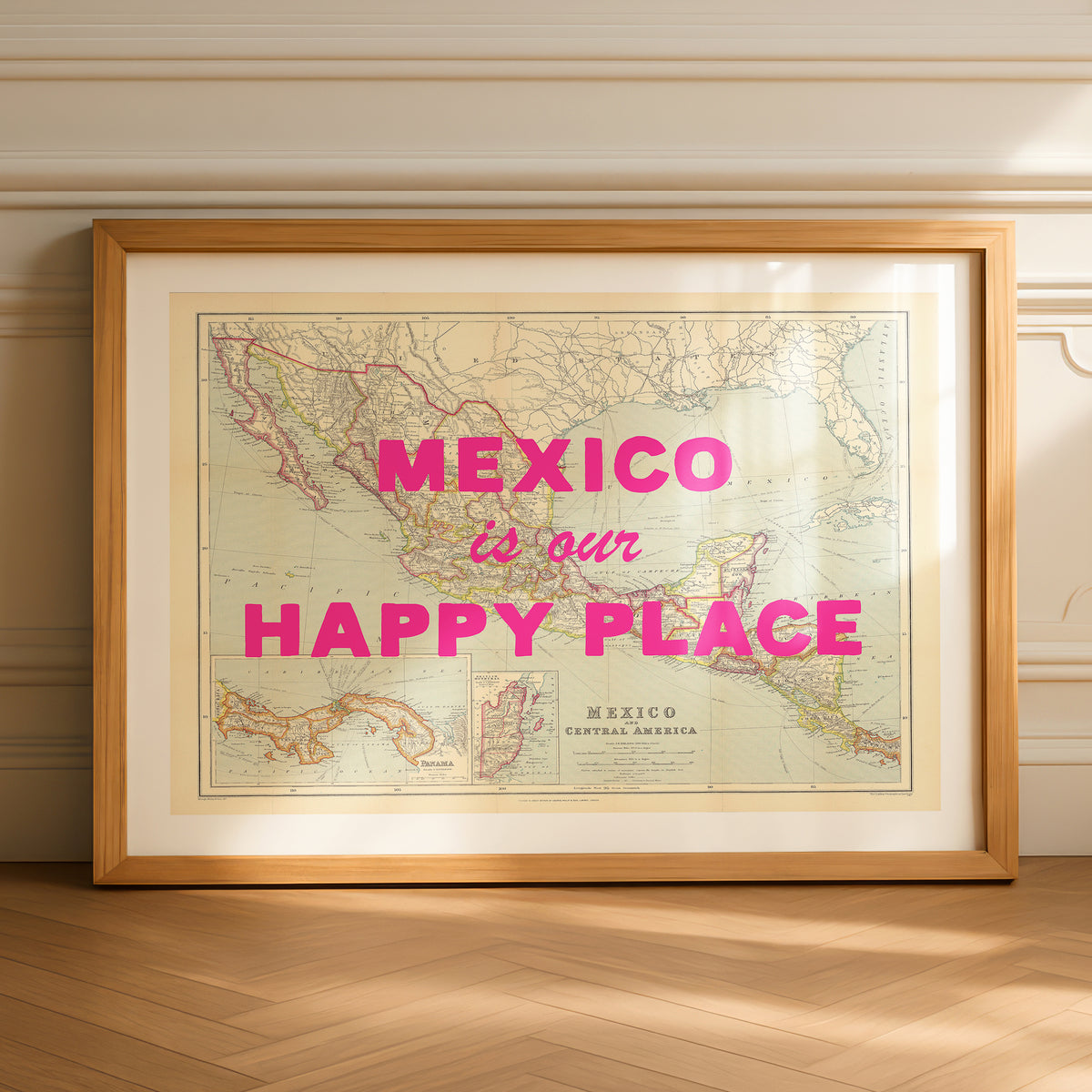 Framed map of Mexico with 'Mexico is our Happy Place' text on a wooden floor.