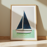 Framed artwork of a sailboat on a light background