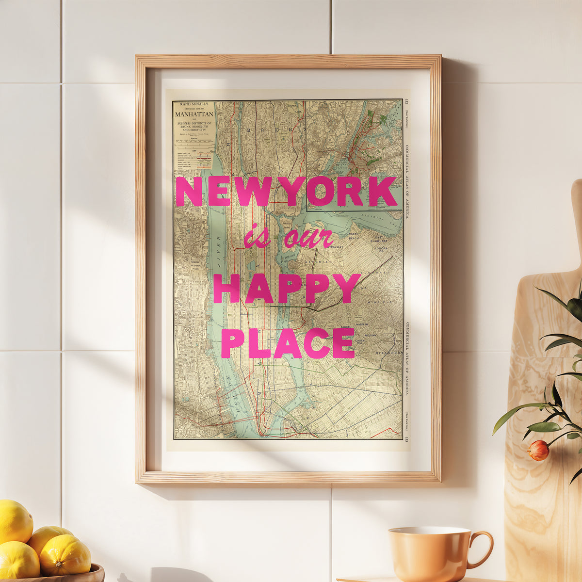 Framed map with 'New York is our happy place' text on a wall.