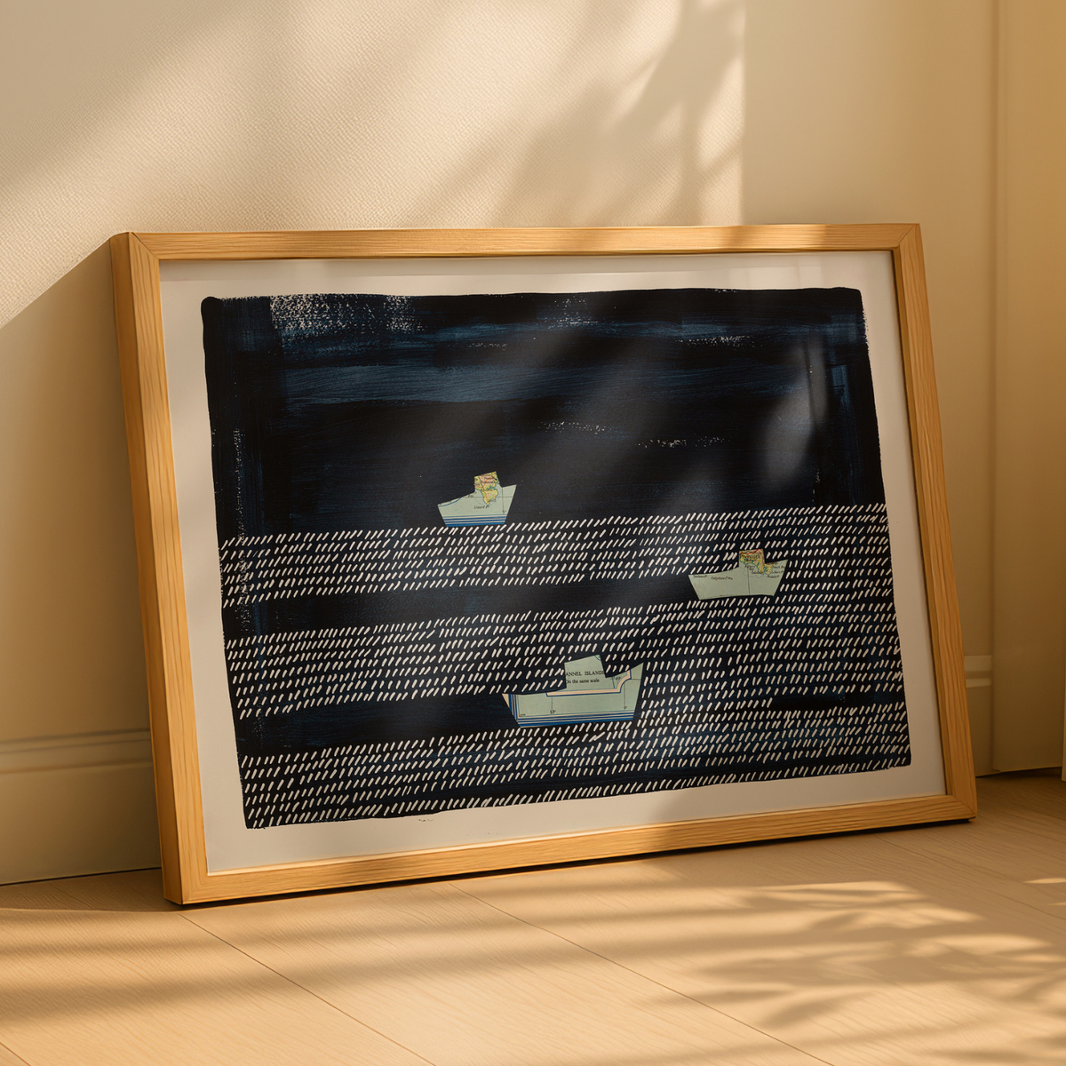 Framed fishing boat art print above in neutral room, navy coastal wall art