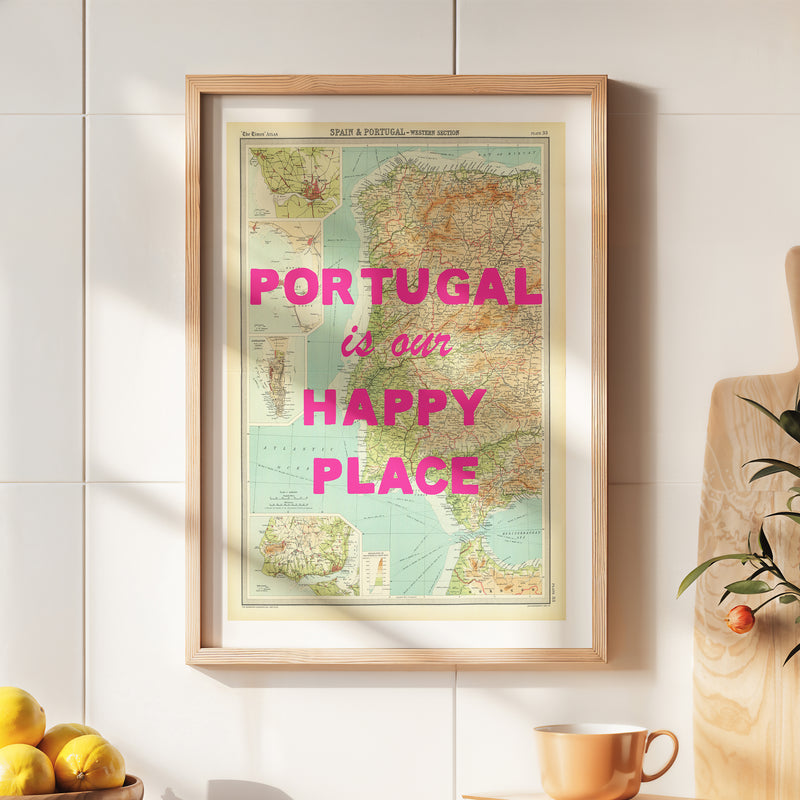 Framed map of Portugal with 'Portugal is our happy place' text on a wall.