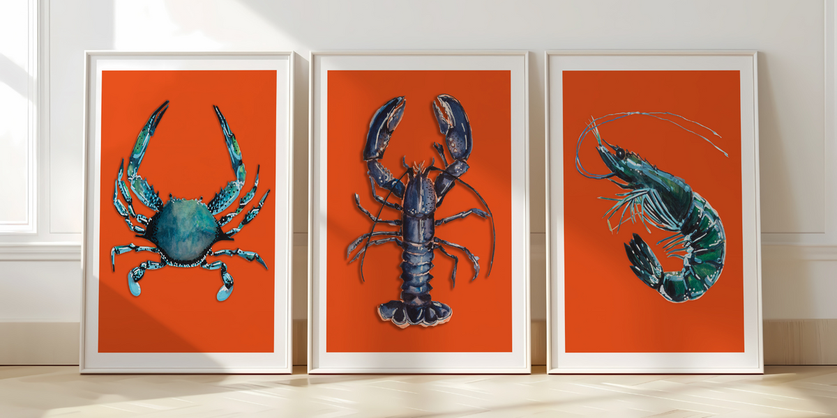 set of three red wall art prints resting on the floor - set of three kitchen art prints with red backgrounds