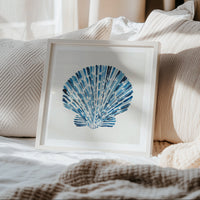 Scallop shell wall art print with layered blue watercolour brushstrokes on a neutral background, contemporary coastal wall art in bedroom.
