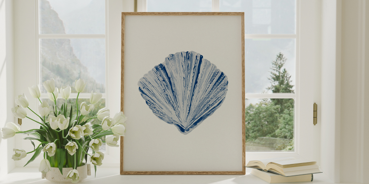 shell art framed on window ledge - seashell art in blue painted