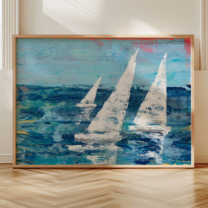 Framed abstract painting of sailboats on a blue sea with a wooden floor and white wall background.