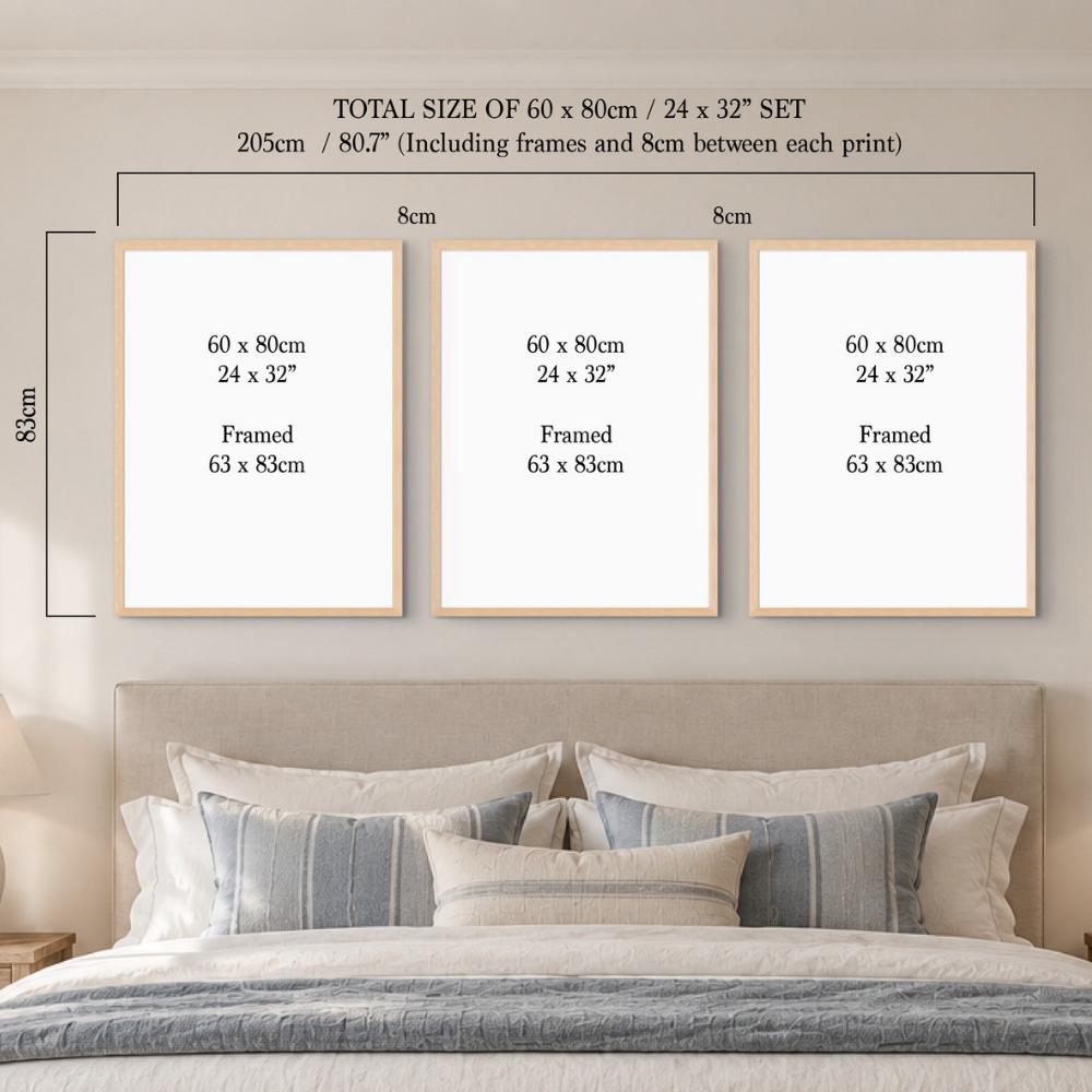 Three framed wall art prints displayed above a bed. The image includes dimension labels and text stating the total size of the set is 60 x 80 cm / 24 x 32" set, 205 cm including frames and spacing, with each print labeled 60 x 80 cm / 24 x 32" and framed 63 x 83 cm.