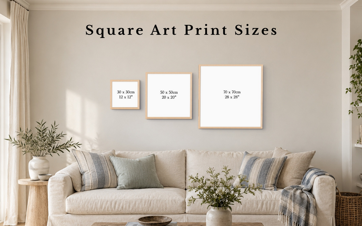Square wall art size guide showing 30 x 30cm, 50 x 50cm and 70 x 70cm framed prints above a sofa.